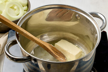 butter is being melted in a pot