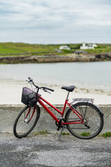 Bike parked on Inishmore, the largest of the Aran Islands in Galway Bay, Ireland. Renting a bicycle is the most popular way to get around Inis Mor. © MNStudio