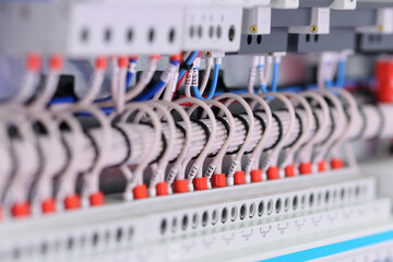 Connection of electrical modules using insulated copper electrical wires. Close-up. Soft focus.