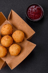 Crispy French fries with mozzarella cheese with raspberry sauce