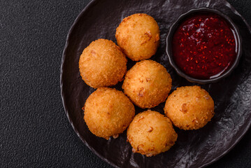 Crispy French fries with mozzarella cheese with raspberry sauce