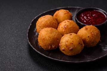 Crispy French fries with mozzarella cheese with raspberry sauce