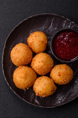 Crispy French fries with mozzarella cheese with raspberry sauce