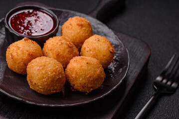 Crispy French fries with mozzarella cheese with raspberry sauce