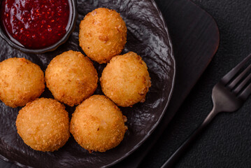 Crispy French fries with mozzarella cheese with raspberry sauce