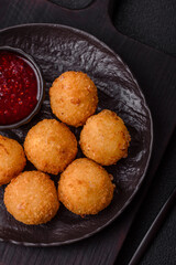 Crispy French fries with mozzarella cheese with raspberry sauce