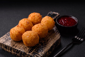 Crispy French fries with mozzarella cheese with raspberry sauce