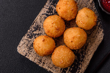 Crispy French fries with mozzarella cheese with raspberry sauce