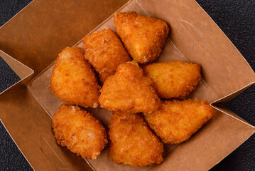 Brie cheese or camembert fries in breading, fast food, takeaway