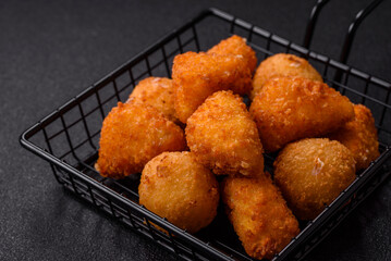 Brie cheese or camembert fries in breading, fast food, takeaway