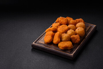 Fast food brie fries, cheese balls and chicken nuggets