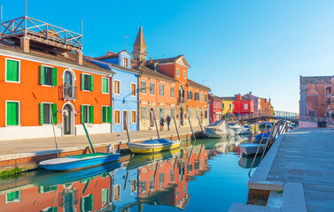 Colorful buildings and boats in Burano, Italy