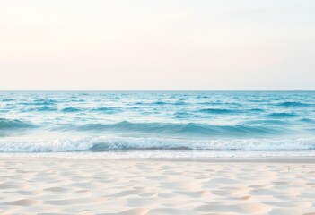 Calm ocean wave on sandy beach. Serene seascape for relaxation, meditation, and summer vacation themes. Perfect for travel brochures and holiday cards.