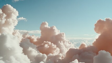 Billowing, creamy clouds give a painterly effect against a clear blue sky.