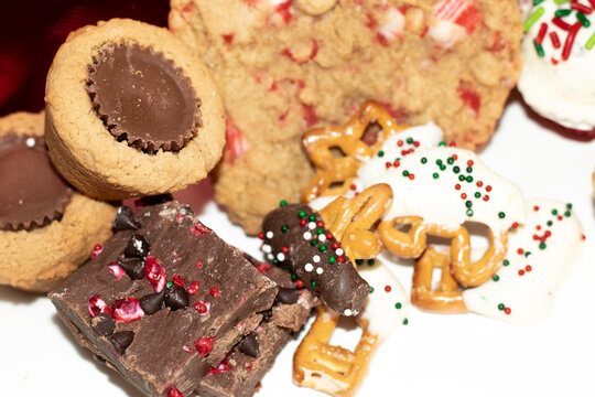 Closeup of assorted holiday treats including cookies and chocolate - Powered by Adobe