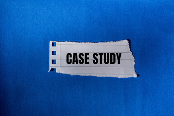 Case study message written on ripped torn paper piece with blue background. Conceptual case study symbol. Copy space.