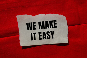 We make it easy message written on ripped torn paper piece on red background. Conceptual we make it...