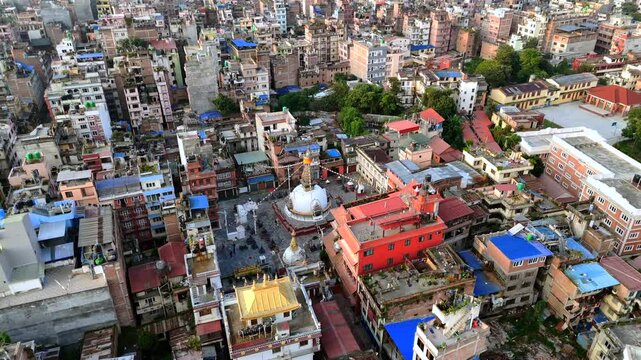 A medium sized Bhuddist stupa near Thamel in the densely packed city of Kathmandu, Nepal (Aerial 4K drone video)