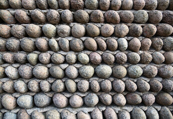 Stone wall texture with egg-shape pebbles