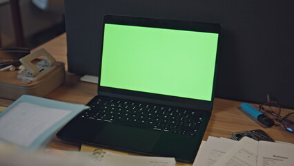 Fototapeta premium Manager hands typing mockup laptop examining documents at late workdesk closeup