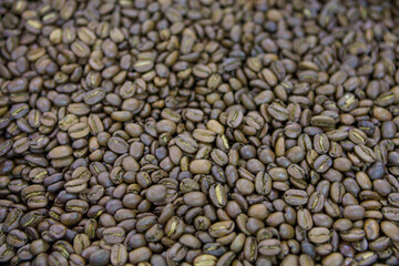 Roasted coffee beans in close up view.