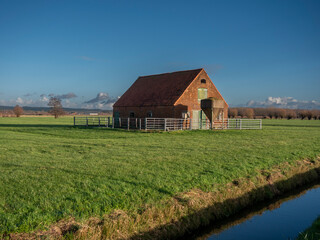 Old farm Barn in the meadow, abandoned