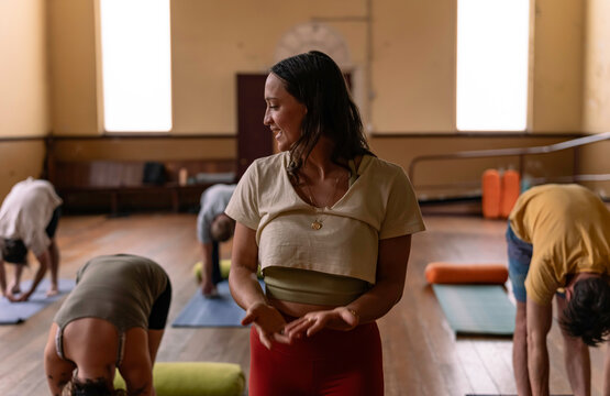 Woman teaching Yoga Class