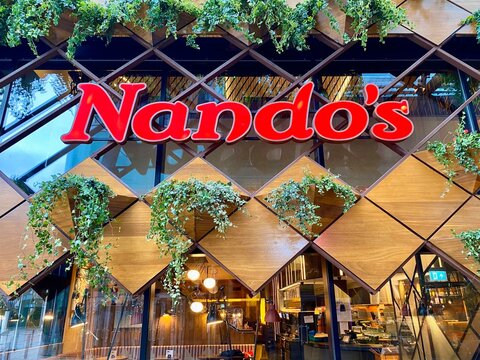 Bracknell, England - January 23, 2025: Nando's is a South African multinational restaurant chain that blends Portuguese and British culture in its food. Especially famous for its Peri Peri Chicken