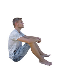 Pensive young man seated down looking up isolated over transparent background. Side view full length portrait thoughtful boy sitting