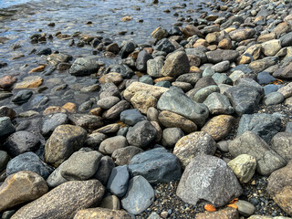 Argentina, Ushuaia - 2023, February: stones on the lake 
