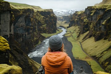 Naklejka premium Majestic canyon view with winding river, surrounded by lush gree