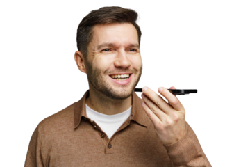 Man smiling while using voice assistant on smartphone in a neutral setting indoors