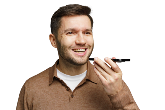 Man smiling while using voice assistant on smartphone in a neutral setting indoors