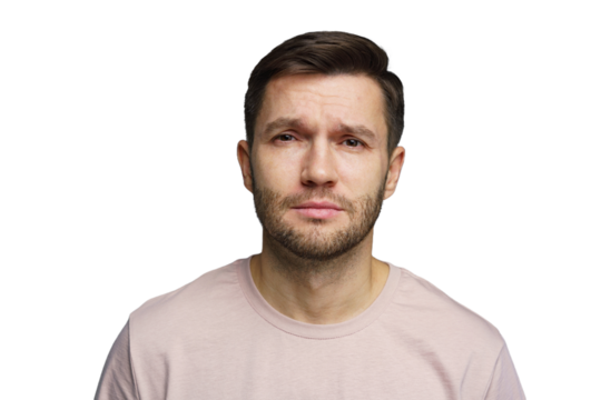 Man with neutral expression wearing a light shirt, staring directly at the camera in a studio setting