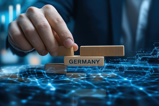 Hand placing Germany block onto digital network