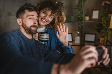 woman and man take self portrait or have video call on cellular