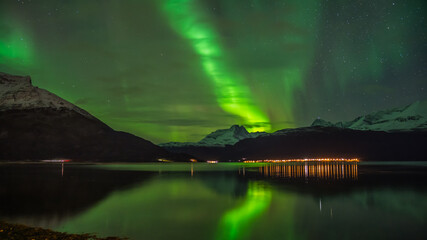 Aurora Borealis over Lyngen mountains in late autumn in northern Norway