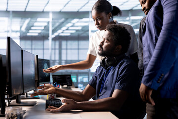 Team of data center programmers using programming languages to construct algorithms and build...