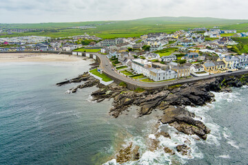 Aerial view of Kilkee, coastal town, popular as a seaside resort, located in horseshoe bay and...