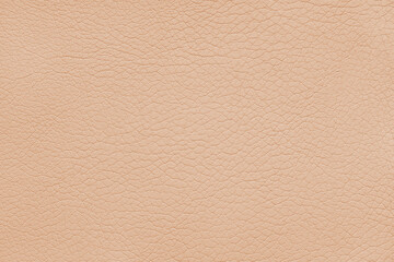 Texture of genuine leather or artificial synthetic leatherette pastel orange color. Skin structure close up, macro, Background, wallpaper, backdrop with copy space.