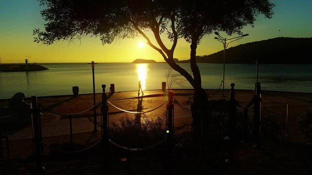 People Silhouette near the Seaside and Morning Sunrise Light in Turkey Datca