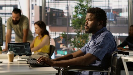 Man with paraplegia conducting code review to fix errors, identifying potential performance and...