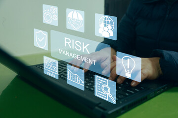 Corporate risk management strategy concept A woman entrepreneur analyzing a virtual risk management...