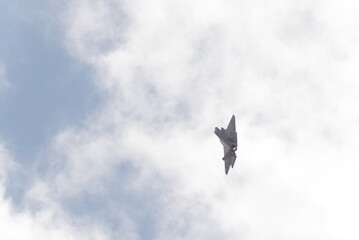 F35 doing stunts at air show and breaking sound barrier. Sonic boom