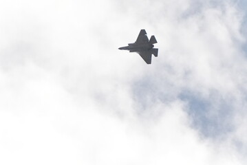 F35 doing stunts at air show and breaking sound barrier. Sonic boom