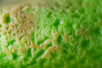 Coconut grated Pandan crepe know as Kuih Dadar. It is combination of sweet filling made from grated...