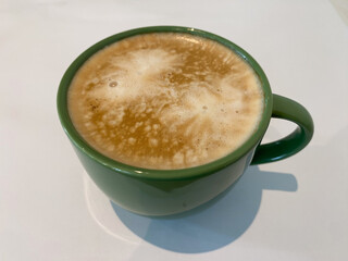 high angle cup of coffee on green cup