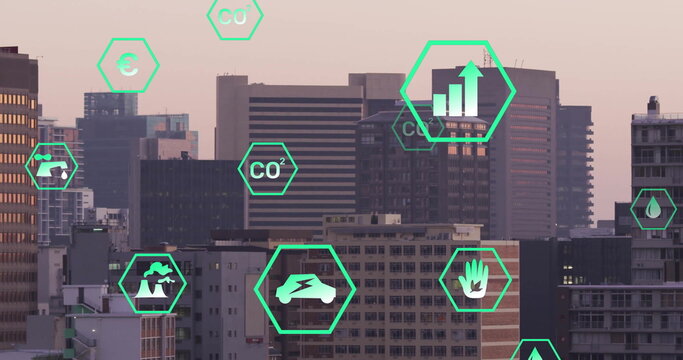 Image of network of eco icons over cityscape