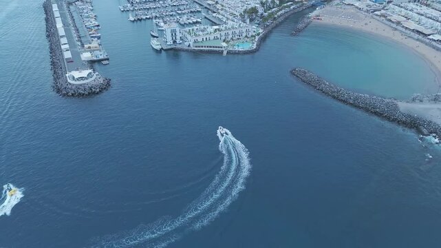 view of a boat entering peurto de mogan in gran canaria