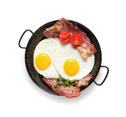 Pan with tasty fried eggs, tomatoes and bacon on white background. Top view
